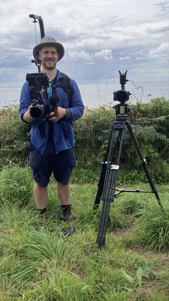 Adam Drake filming on location in Cornwall, behind the scenes